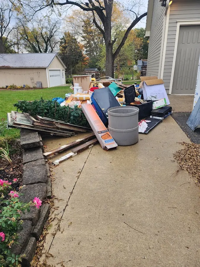 Dumpster being loaded with debris for Commercial Dumpster Rental in Waynesboro